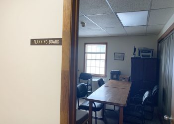 Town of Hamden Planning Board meeting room with brown table and black chairs